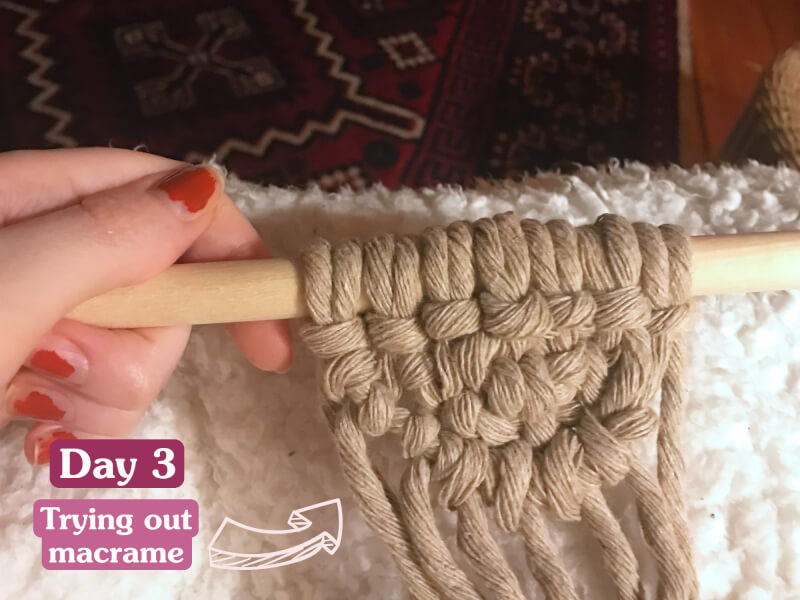 Hand holding macrame.